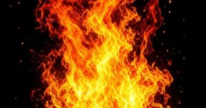 Close-up of bright orange flames against black background, symbolizing fresh fire and spiritual renewal
